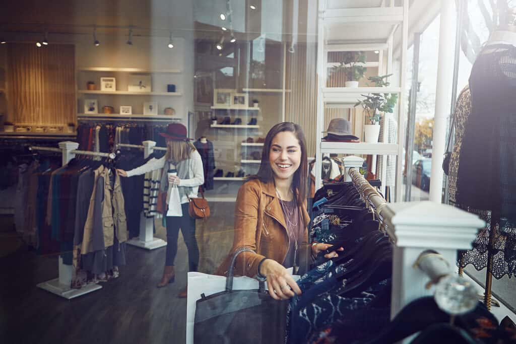 A woman shopping in a clothing store.