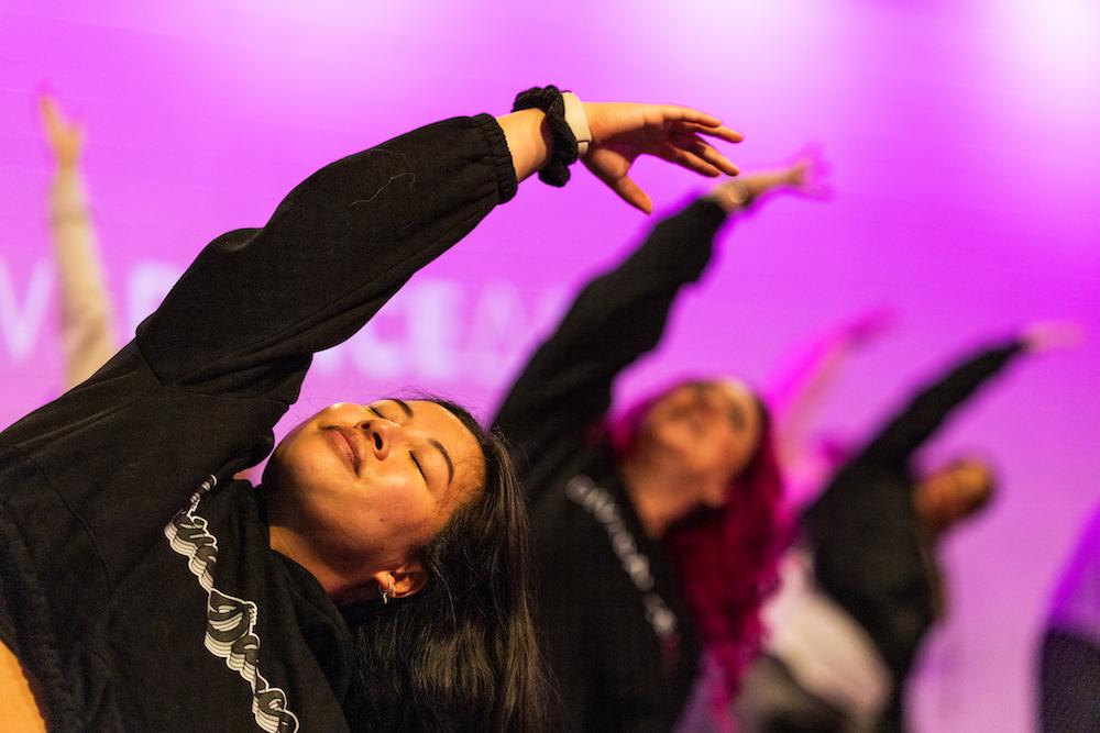 A group of women stretch during a DivaDance DanceRx class