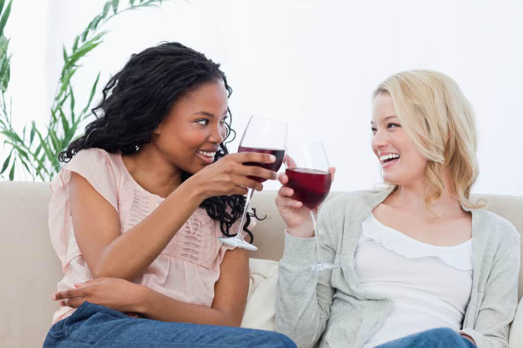 Enjoying wine on a couch in Sugar Land.