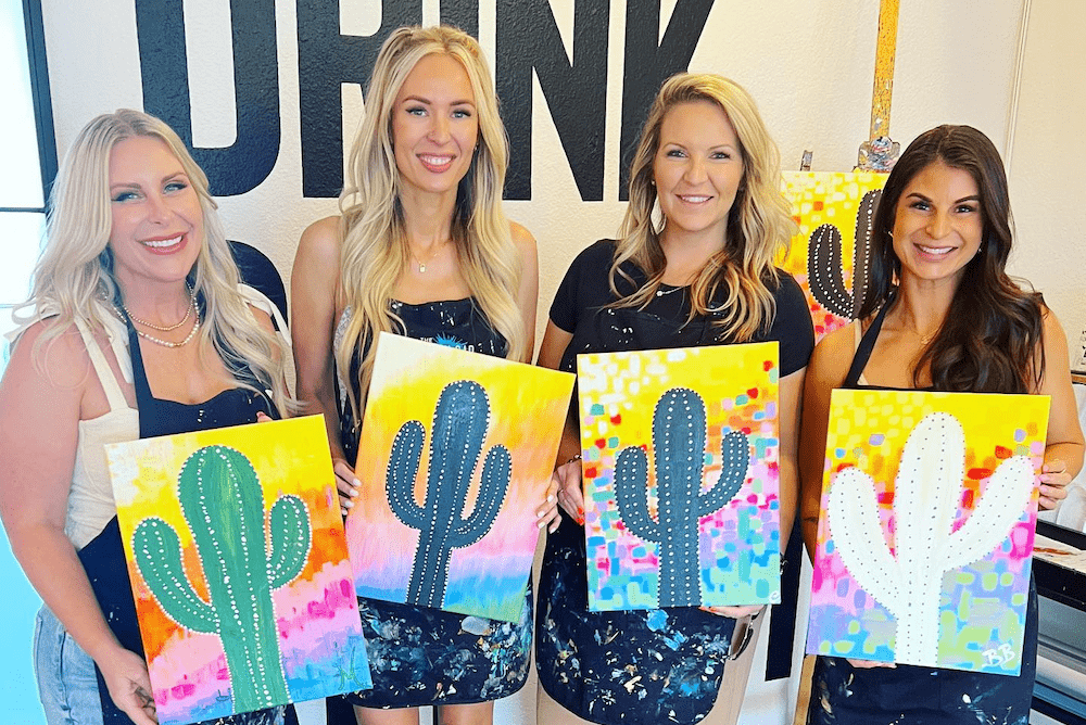 Four women finish a painting class at The Brush Bar in Scottsdale