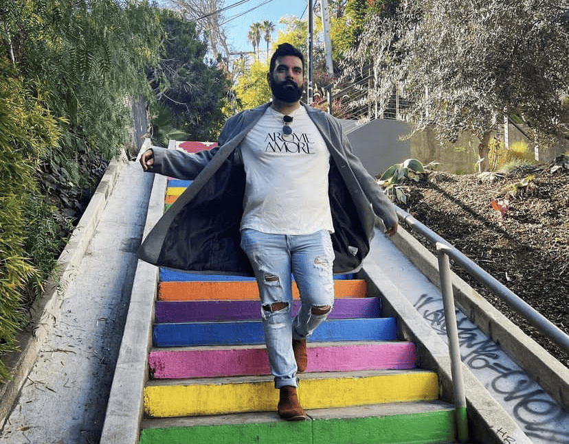 cesar phillips walking down rainbow-hued stairs