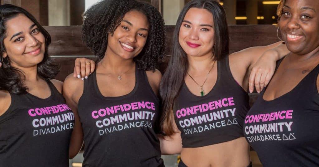 Four Diverse Women With Their Arms Around Each Other