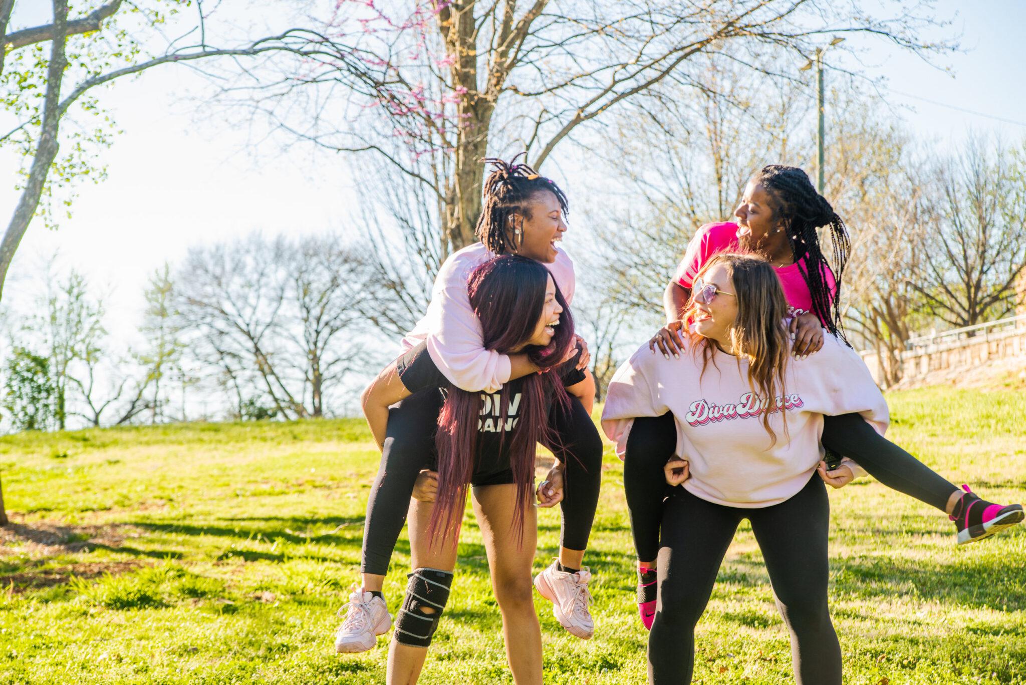 Four girls having fun outside
