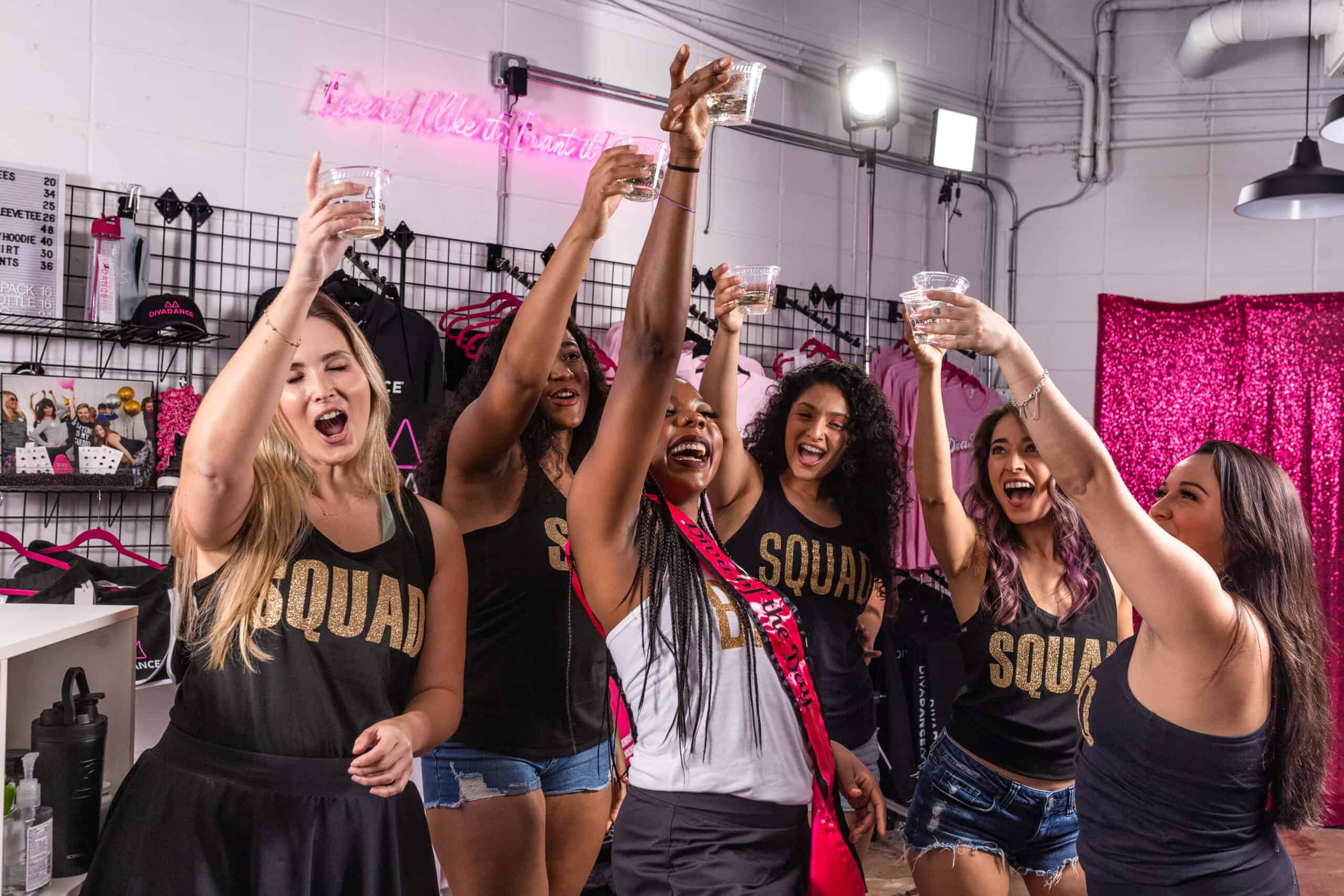A group of women celebrating in a party room.