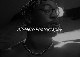 black and white image, man with glasses and necklace
