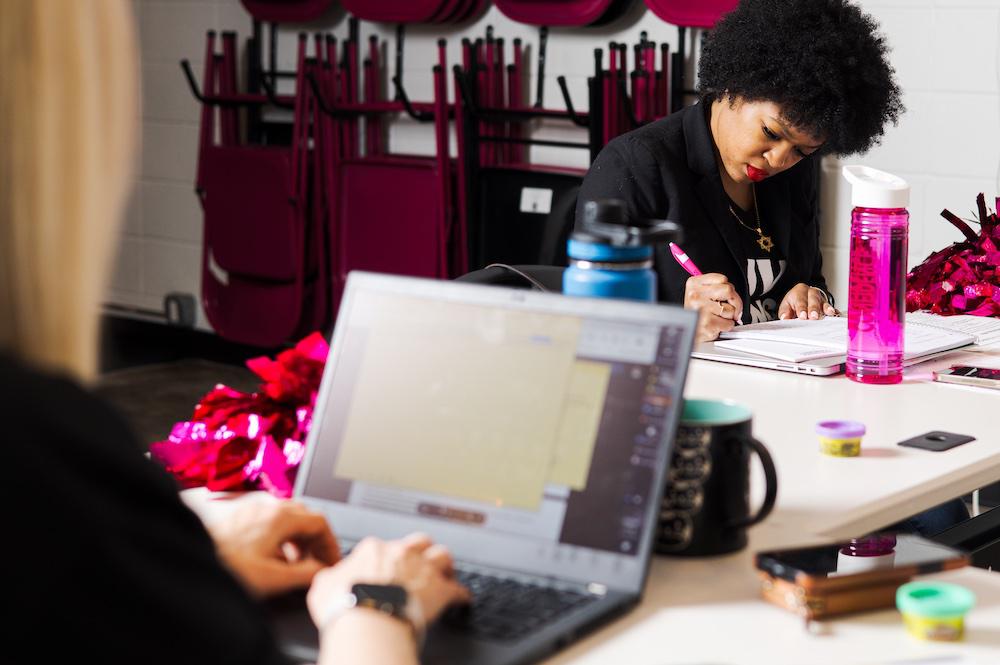 A woman on a computer at a DivaDance conference