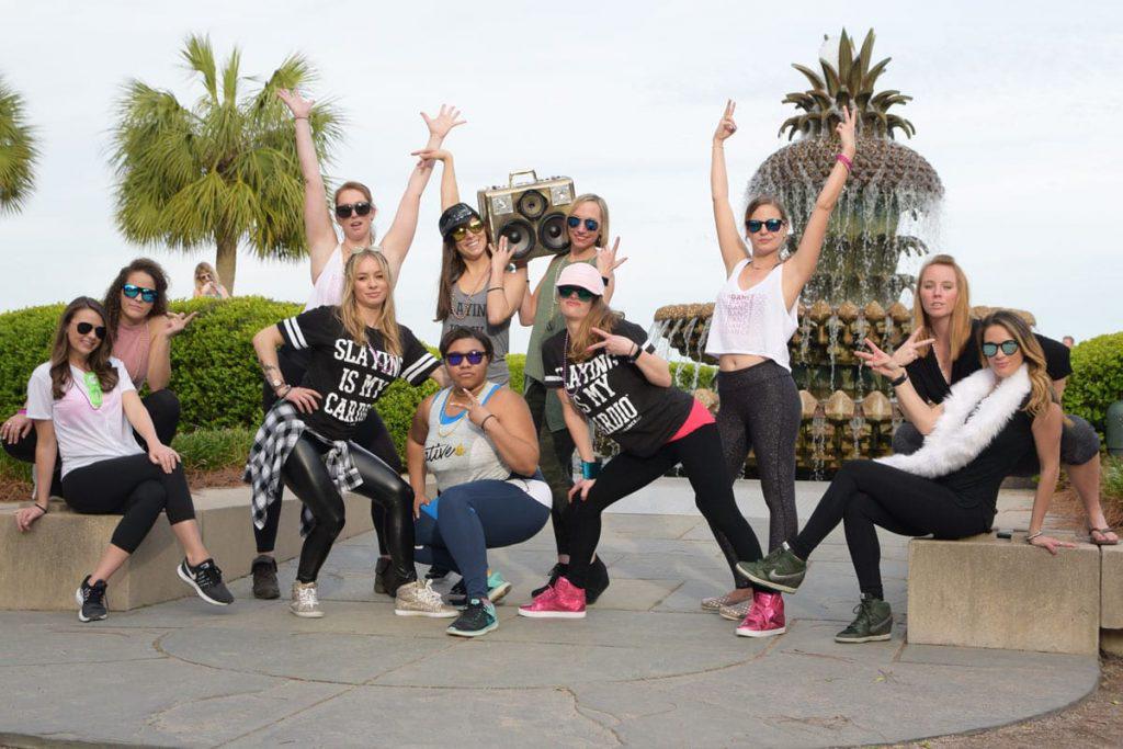 women having a party in front of trees in divadance gear