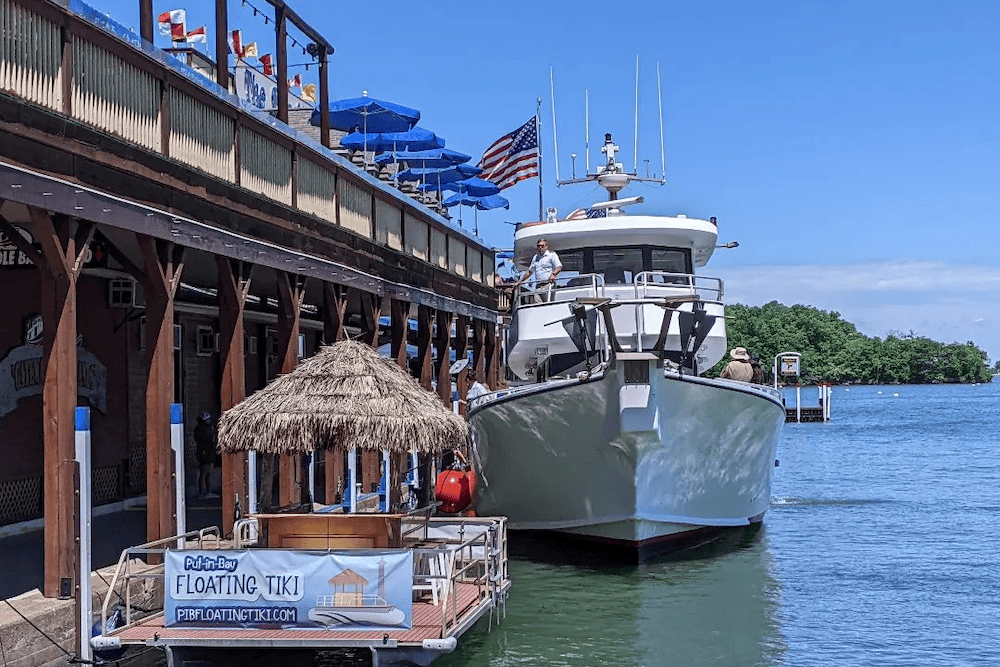 A boat docked at a dock near a building, offering visitors one of the best things to do in Toledo.