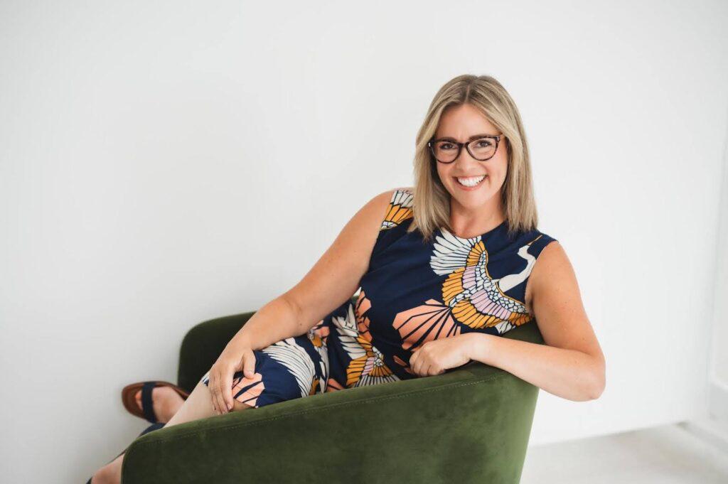Woman smiling sitting on the couch