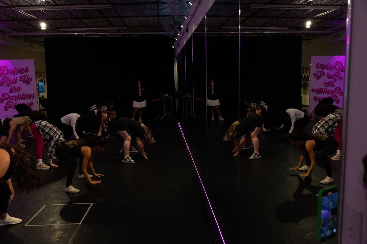 DivaDance members moving together through a low-impact dance routine at the Austin studio