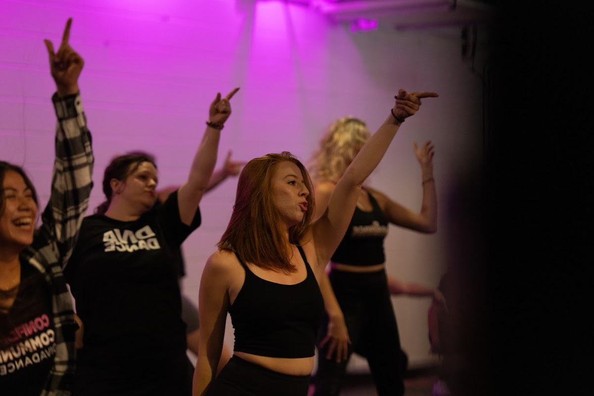 Adults learning low-impact dance choreography together during a DivaDance class
